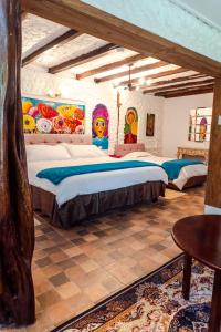 Voodi või voodid majutusasutuse Spa Hosteria Miramelindo toas