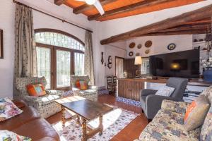 a living room with a couch and a table at Mas Xanxo in Riudoms