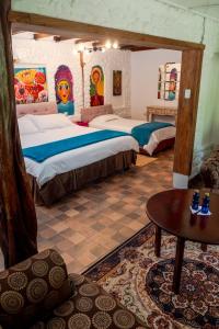 Voodi või voodid majutusasutuse Spa Hosteria Miramelindo toas