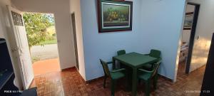 a small green table and chairs in a room at CASA DANY in Guaduas