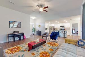a living room with a couch and a table at Pensacola Heights in Pensacola