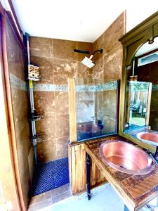 a bathroom with a sink and a shower at Sedona Camp Tiny House in Sedona