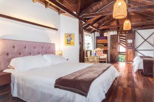 Voodi või voodid majutusasutuse Spa Hosteria Miramelindo toas