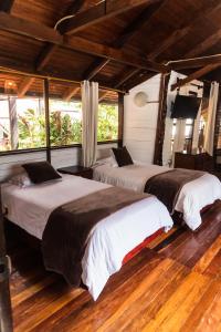 Voodi või voodid majutusasutuse Spa Hosteria Miramelindo toas