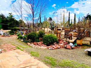 a garden with rocks and plants in a yard at Sedona Camp Tiny House in Sedona