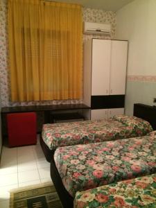 Ένα ή περισσότερα κρεβάτια σε δωμάτιο στο Hotel Letizia