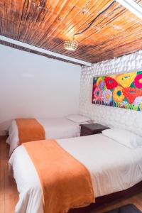 Voodi või voodid majutusasutuse Spa Hosteria Miramelindo toas