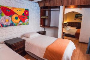 Voodi või voodid majutusasutuse Spa Hosteria Miramelindo toas