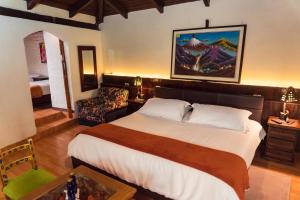 Voodi või voodid majutusasutuse Spa Hosteria Miramelindo toas