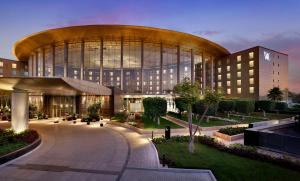 a large building with a large elliptical building at Waldorf Astoria Cairo Heliopolis in Cairo