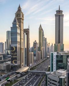 a view of a city with a clock tower at Dubai Entire Serviced Room Unit Excellence in Dubai