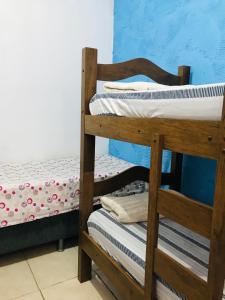 a pair of bunk beds in a room at Hospedaria Dos Astros in São Thomé das Letras