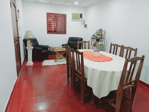 a dining room with a table and chairs at Casa familiar in Corrientes