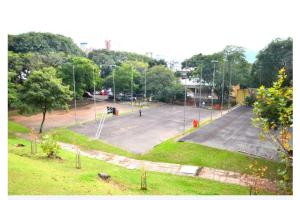 an empty parking lot with a parking at Apartamento Parque Itaimbé - Centro - Garagem in Santa Maria