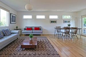 a living room with a couch and a table at Spacious Boulder home! in Boulder