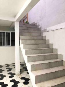 a stairway in a house with a stair case at Encontro Open House in São Paulo