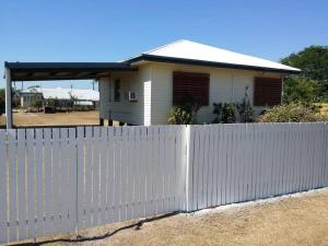 a white fence in front of a house at 3 bed room house near airport in North Ward