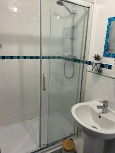 a bathroom with a shower and a sink at Long Stay - Free Parking - Contractors - Train Station - Students in Colchester