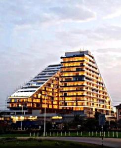 a large building with a lot of windows at The Signature Hotel Apartment Accra Ghana in Accra