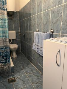 a bathroom with a toilet and a sink at Apartments Nautilus in Ulcinj +64 photos
