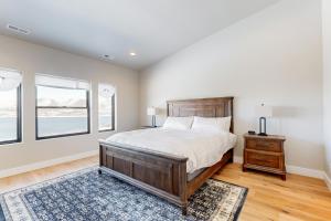 a bedroom with a large bed and a window at Sparkling Waters in Heber City
