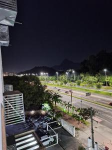 a view of a street at night from a building at Minha Praia Condomínios 2 in Rio de Janeiro
