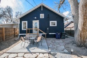 a blue house with a table and chairs in front of it at 3 Bed Fully Renovated Denver University in Denver