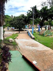 a playground with a pool of water in a park at Casa de Temporada das Mangueiras in Olinda