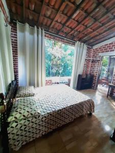 Postel nebo postele na pokoji v ubytování Casa de Temporada das Mangueiras + 37 fotografií