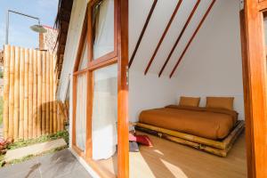 Postel nebo postele na pokoji v ubytování BAMBOO SHACK