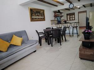 a living room with a couch and a table at HOSPEDAJE - SANDANED in Villa de Leyva