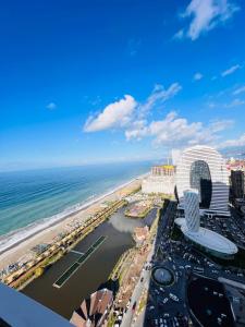 an aerial view of a resort and the beach at Luxury Aparthotel orbi in black sea arena in Batumi