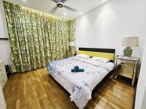 Ένα ή περισσότερα κρεβάτια σε δωμάτιο στο Blue Sky Apartment