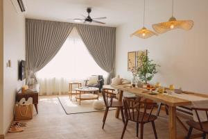 a living room with a dining room table with chairs at Lazy Cozy Summer Afternoon Healing Daily Life in Klang