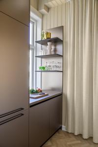 a kitchen with a pantry with a window at BA61 - Lux 4 bedrooms, 260 sqm, 2 balconies, Free Parking in Oslo