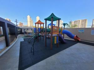 a playground with a slide and a slideintend at Copaiba 3Q e 3B em Águas Claras - Brasília in Águas Claras