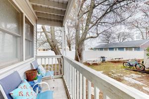 a porch with two chairs and a picnic table on a house at Atlantic Mist 103 in Ocean City