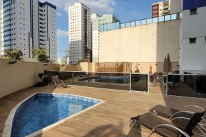 a swimming pool on the roof of a building at Copaiba 3Q e 3B em Águas Claras - Brasília in Águas Claras