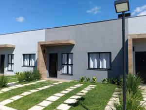 a rendering of the exterior of a house at Arambo Viagens e Hospedagens Loft 31 in Jaguarão