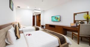 Postel nebo postele na pokoji v ubytování T78 Nha Trang Hotel