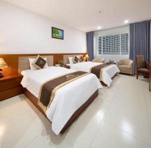 Postel nebo postele na pokoji v ubytování T78 Nha Trang Hotel