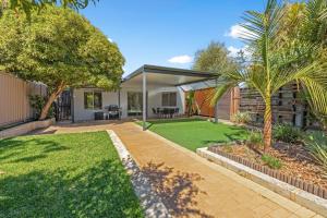 a home with a garden with a lawn at Maylands Coastal Vibes in Perth