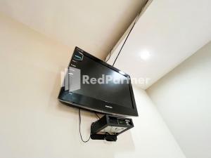 En TV eller et underholdningssystem på Griya Borobudur Malang Syariah RedPartner
