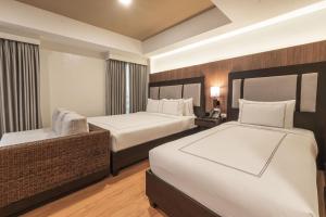 Widus Hotel Clark客房内的一张或多张床位