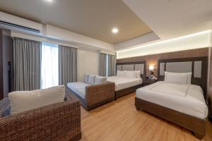 Widus Hotel Clark客房内的一张或多张床位