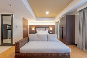 Widus Hotel Clark客房内的一张或多张床位