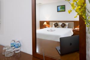 Postel nebo postele na pokoji v ubytování T78 Nha Trang Hotel