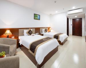 Postel nebo postele na pokoji v ubytování T78 Nha Trang Hotel