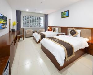 Postel nebo postele na pokoji v ubytování T78 Nha Trang Hotel
