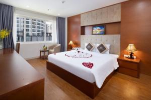 Postel nebo postele na pokoji v ubytování T78 Nha Trang Hotel